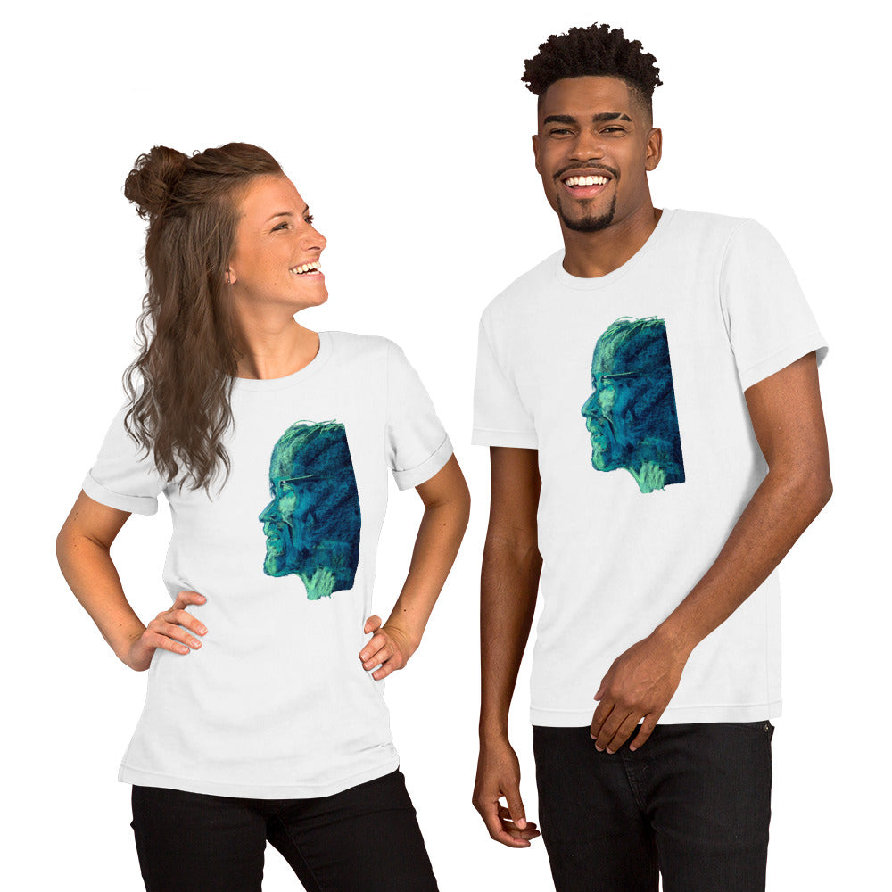 Face emerging in shades of green and deep blue printed on a white t-shirt – design by Ilaria Berenice.